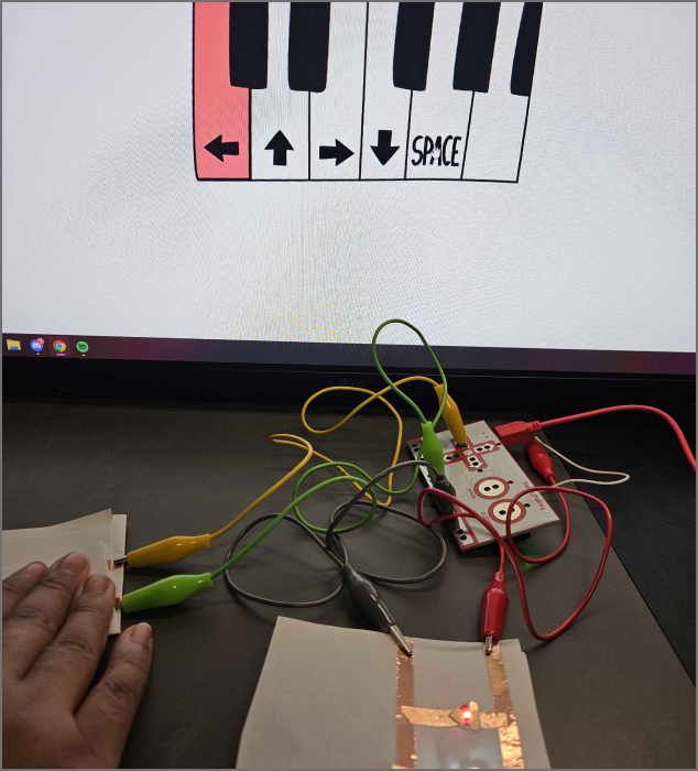 a parallel circuit also showcasing the key being press down, it will turn off when the person lets go of the switch