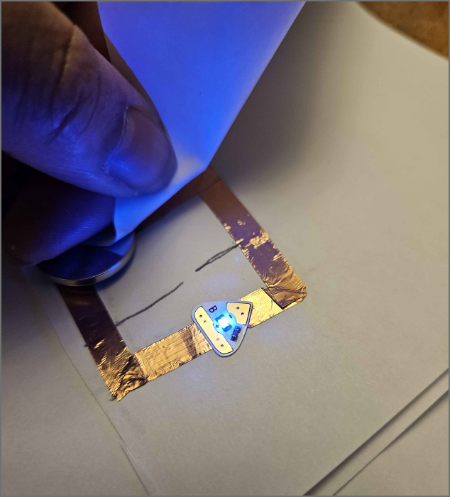 testing out a simple circuit, acting as a switch by connecting both ends of the wires